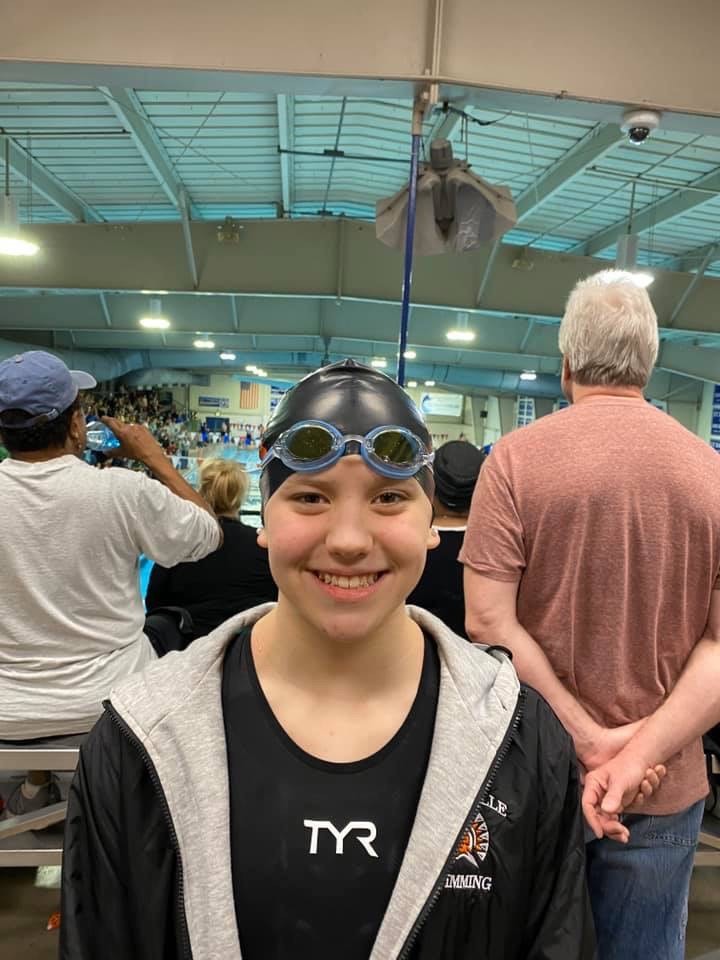 girl wearing a swim cap